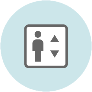Elevator icon with a person figure and up-down arrows on a light blue circular background.
