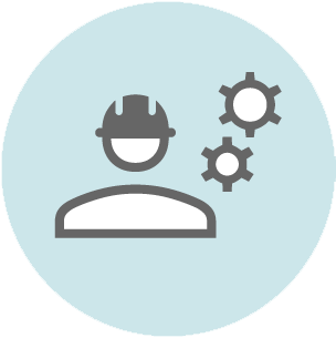 Gray icon showing a person wearing a hard hat with two gear symbols above, on a light blue circular background.