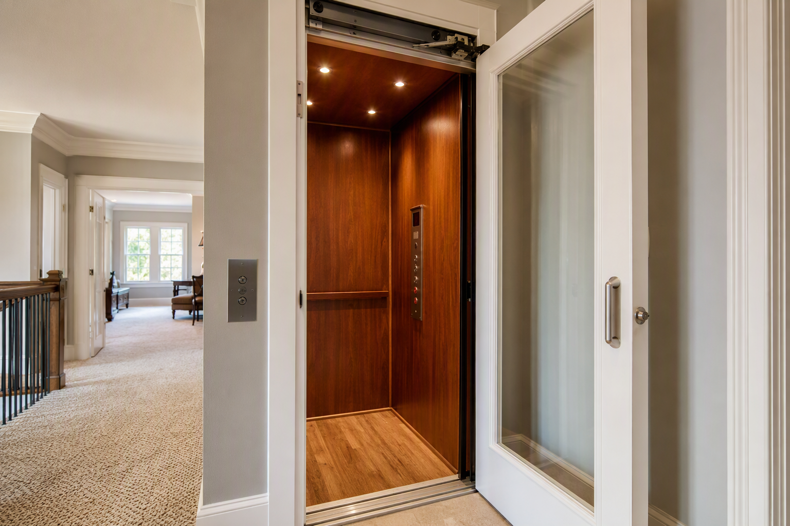 Residential in-home elevator with wood-panel interior and brushed nickel fixtures inside a two-story Columbia SC home, serviced by a certified elevator company.