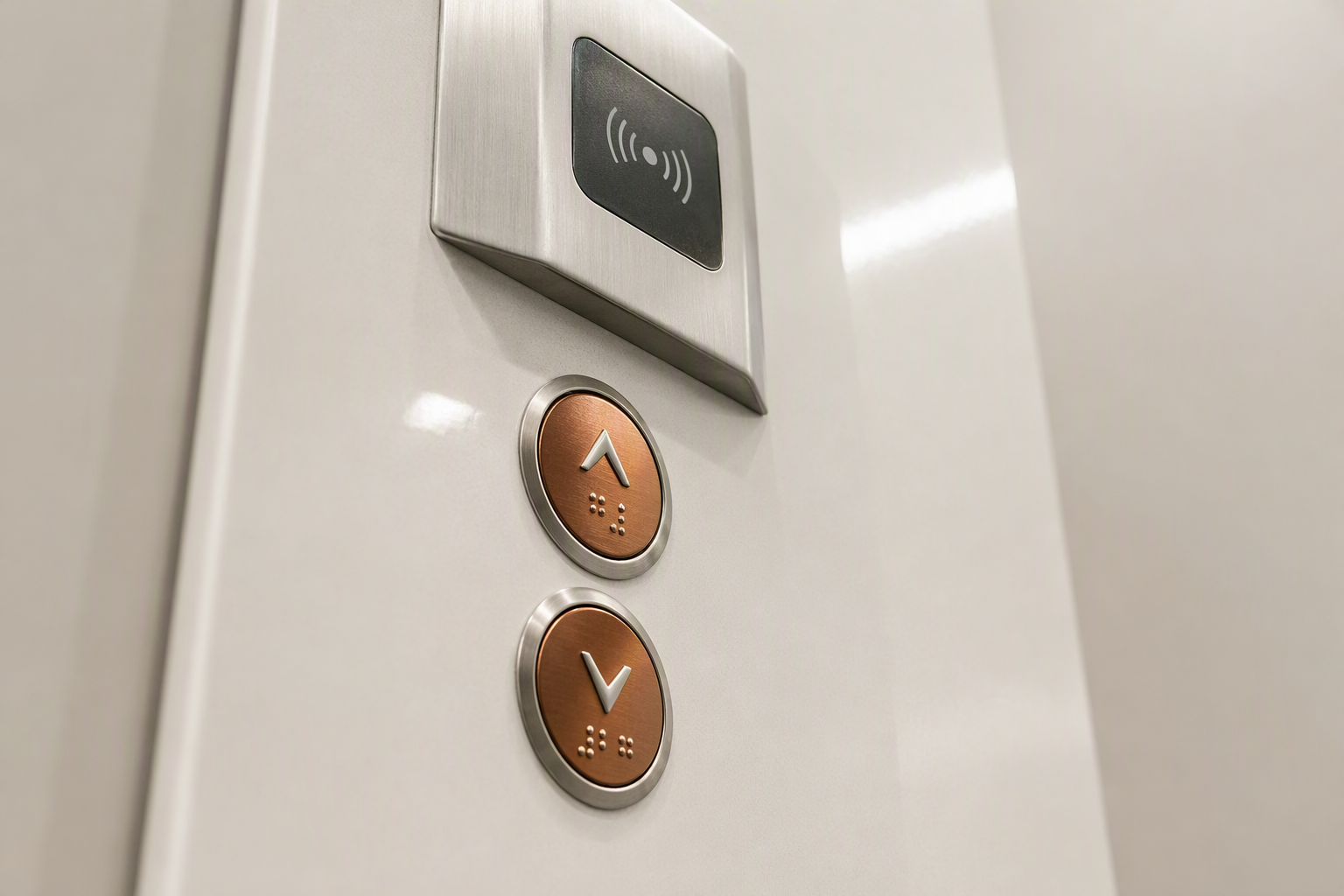 Antimicrobial Elevator Button and Sensor Detail Close-up of hospital elevator copper-alloy antimicrobial call buttons and hands-free wave sensor mounted on a seamless HPL wall panel for infection control compliance